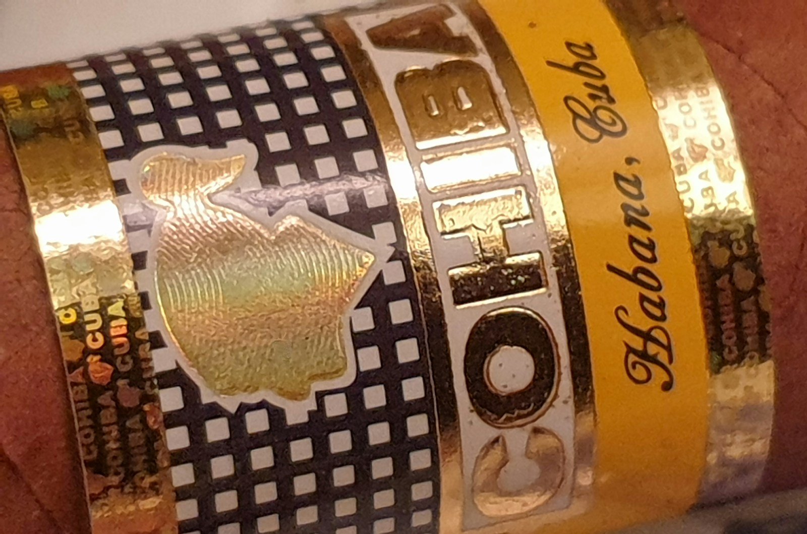 gold and black labeled bottle